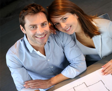 Couple looking at house plans.